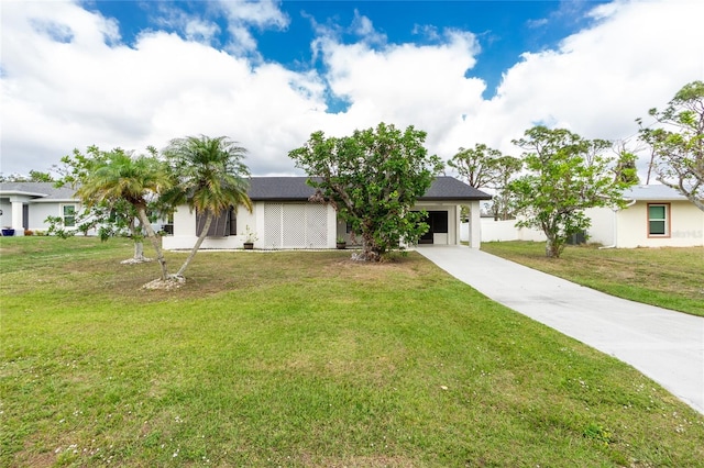 ranch-style home featuring a front lawn and a garage