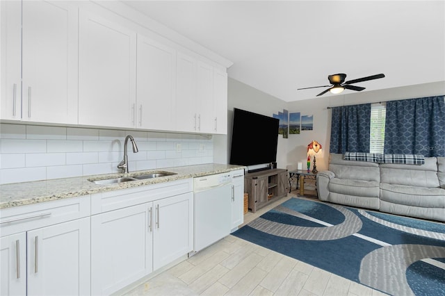 living room featuring ceiling fan, light hardwood / wood-style flooring, and sink