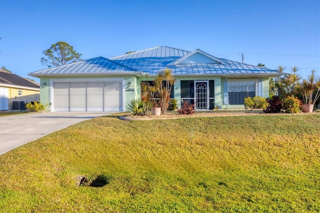 single story home with concrete driveway, stucco siding, cooling unit, metal roof, and a garage