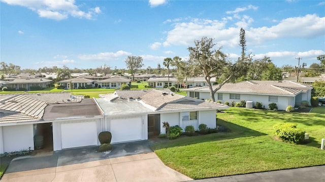 ranch-style house with a garage and a front yard