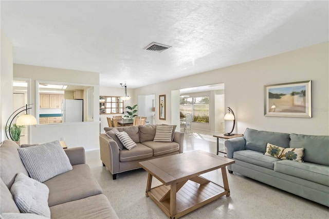 living room with a textured ceiling