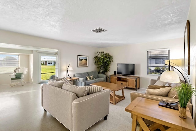 living room with a textured ceiling