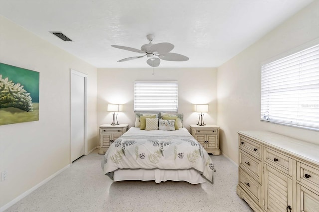 bedroom featuring multiple windows and ceiling fan