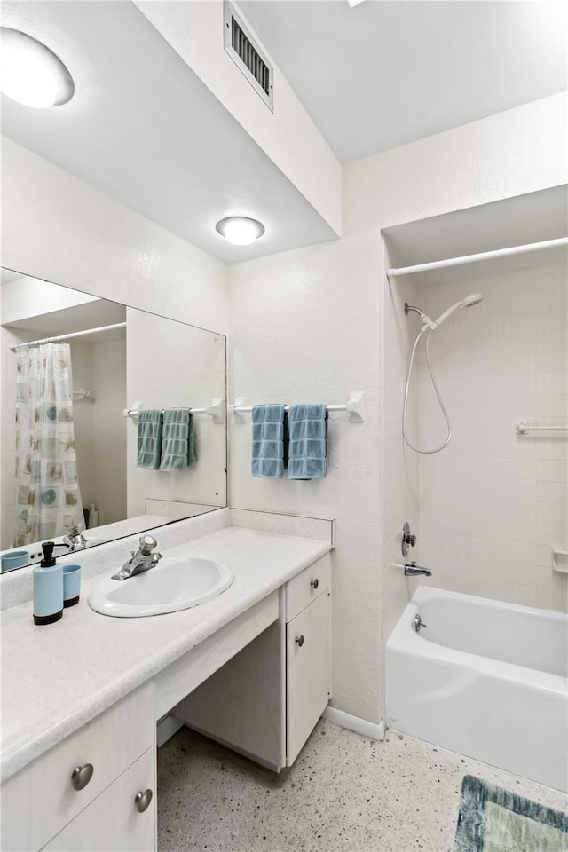 bathroom featuring vanity and shower / tub combo with curtain