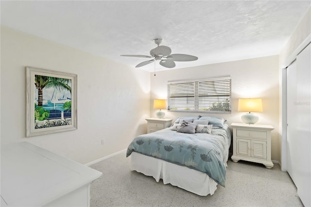 bedroom featuring a textured ceiling, a closet, and ceiling fan