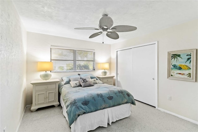 bedroom with ceiling fan, a closet, and a textured ceiling