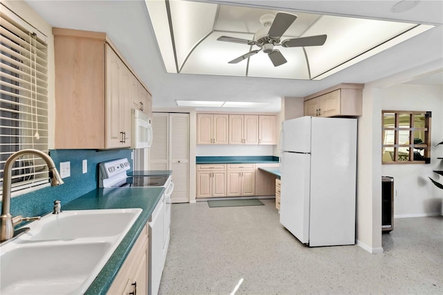 kitchen with light brown cabinetry, sink, white appliances, and ceiling fan