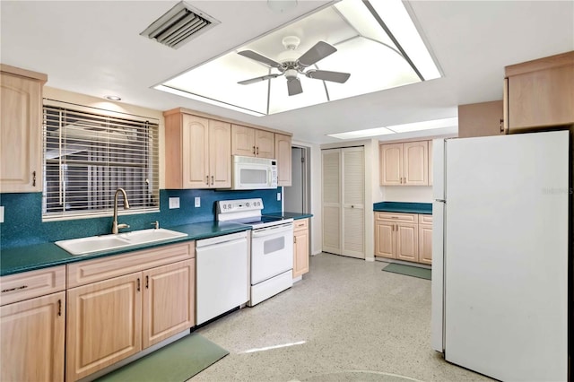 kitchen featuring ceiling fan, sink, light brown cabinetry, and white appliances