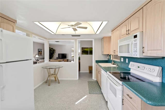 kitchen featuring ceiling fan, white appliances, light brown cabinetry, and sink