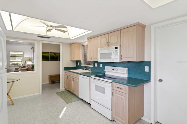 kitchen featuring light brown cabinetry, sink, white appliances, ceiling fan, and decorative backsplash