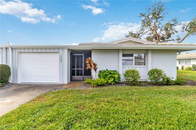 single story home with a garage and a front yard