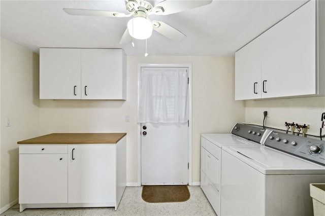 laundry area featuring ceiling fan, cabinets, and washing machine and clothes dryer