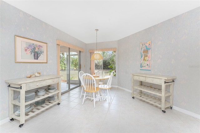 dining space featuring tile patterned flooring, baseboards, and wallpapered walls