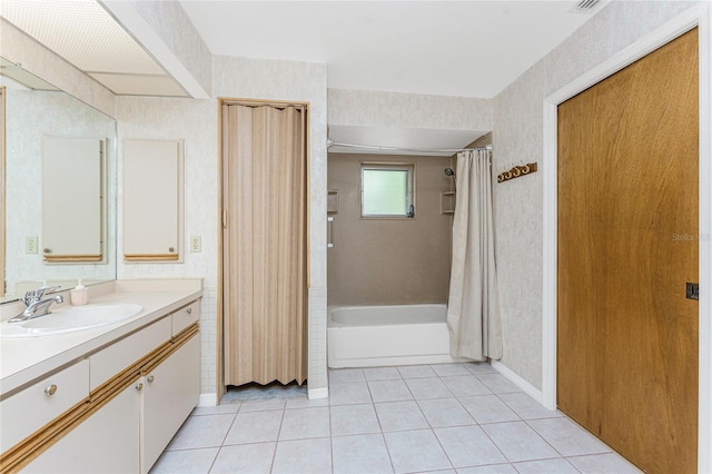 bathroom with vanity, baseboards, wallpapered walls, shower / bath combo, and tile patterned flooring