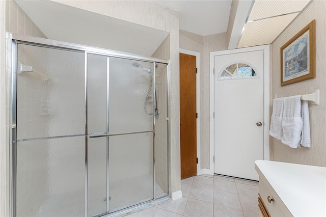 bathroom featuring a stall shower, vanity, and tile patterned flooring