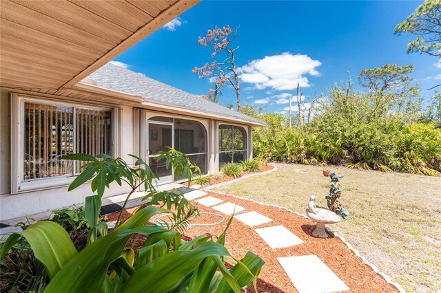 view of yard with a sunroom