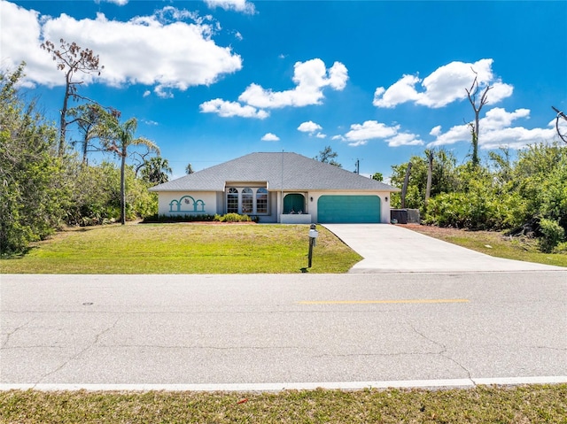 single story home with a garage, a front yard, stucco siding, and concrete driveway