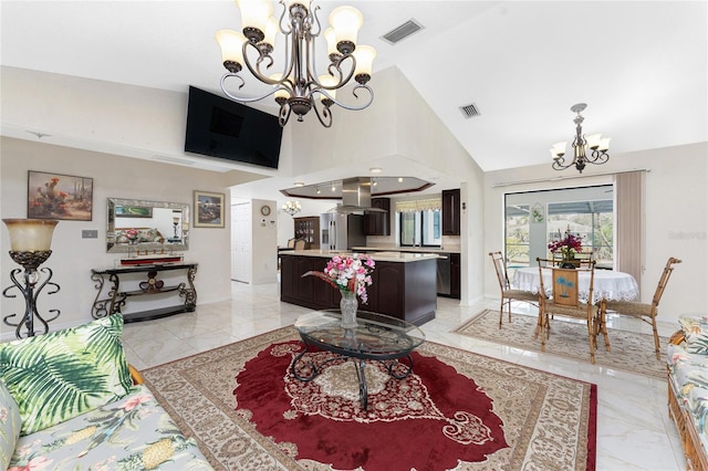 living area with marble finish floor, visible vents, baseboards, and an inviting chandelier