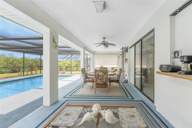 sunroom featuring a swimming pool