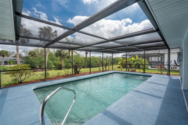 pool with glass enclosure and a patio