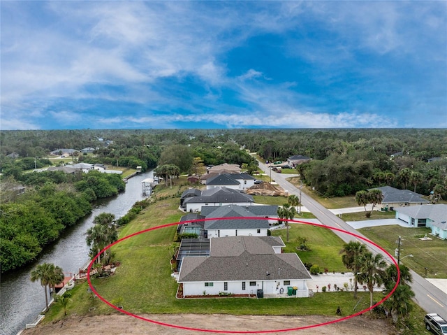 aerial view featuring a water view and a residential view