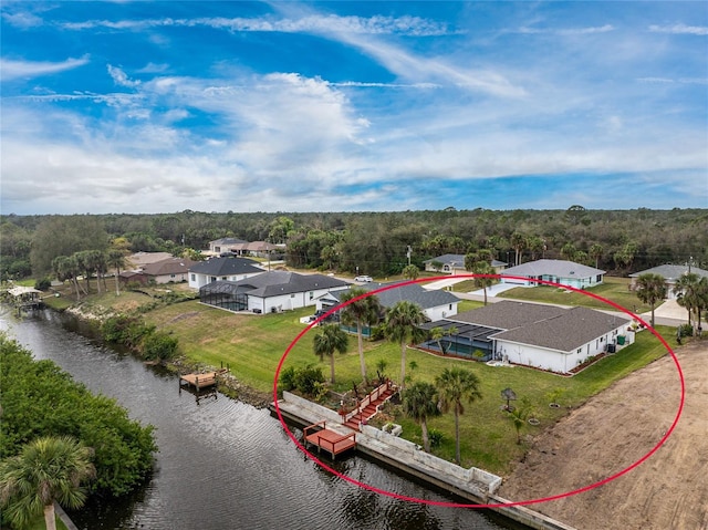 bird's eye view with a water view and a residential view