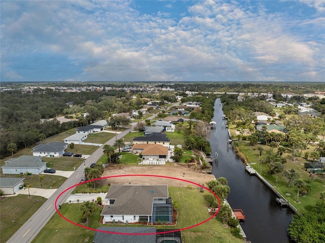 aerial view with a water view and a residential view