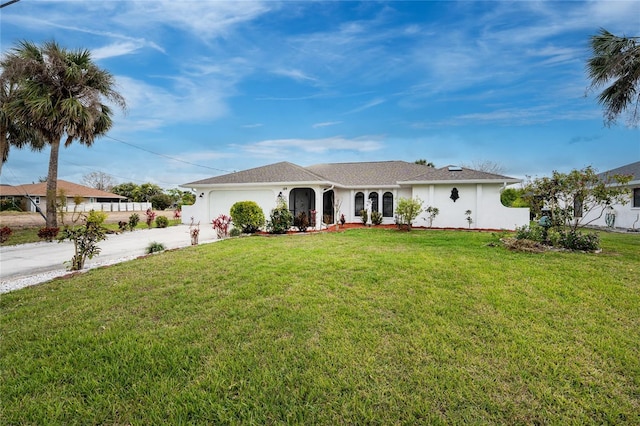 ranch-style house with a garage, a front lawn, concrete driveway, and stucco siding