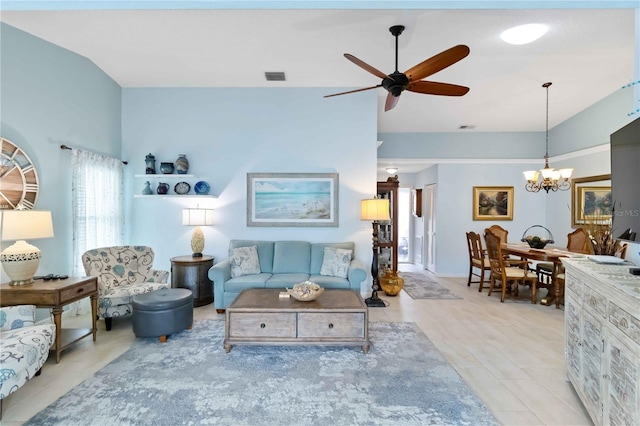 living room featuring visible vents, vaulted ceiling, and ceiling fan with notable chandelier