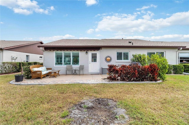 rear view of property with central AC unit, a lawn, a patio area, and stucco siding