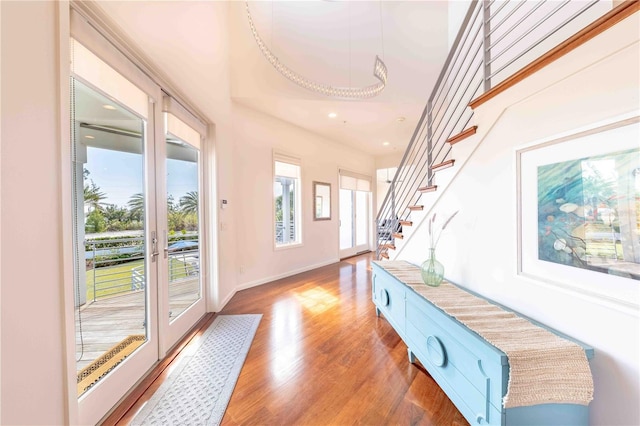 entryway with hardwood / wood-style flooring and french doors