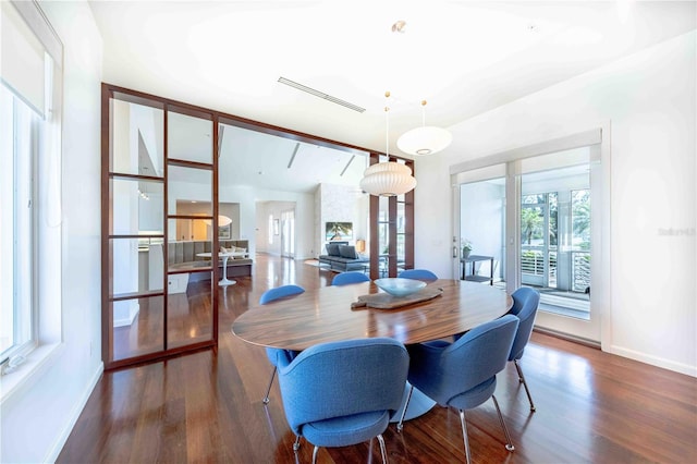 dining room with dark wood-type flooring