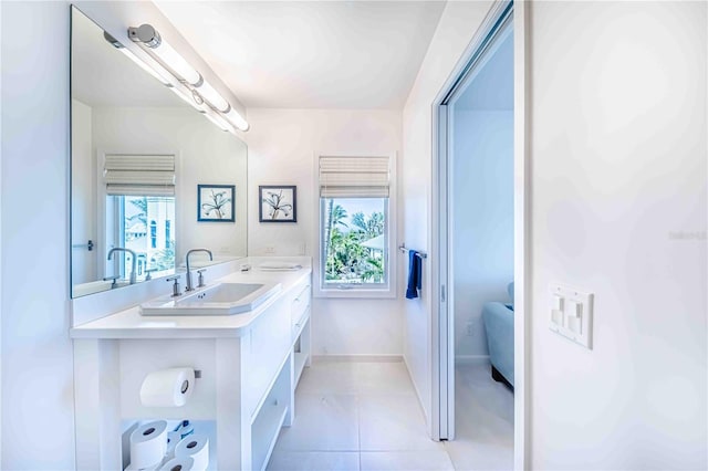 bathroom featuring vanity, a wealth of natural light, and tile patterned floors