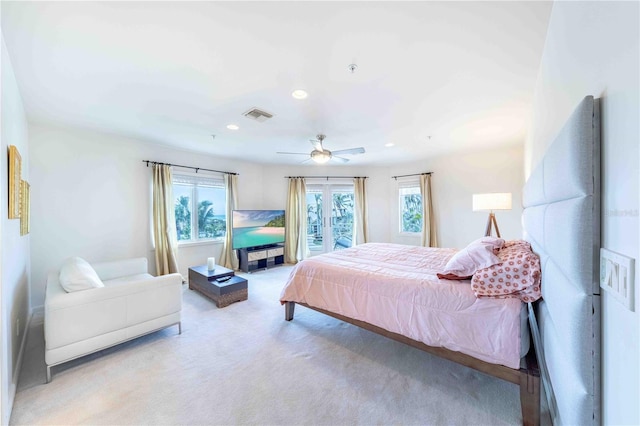 bedroom featuring light colored carpet and ceiling fan