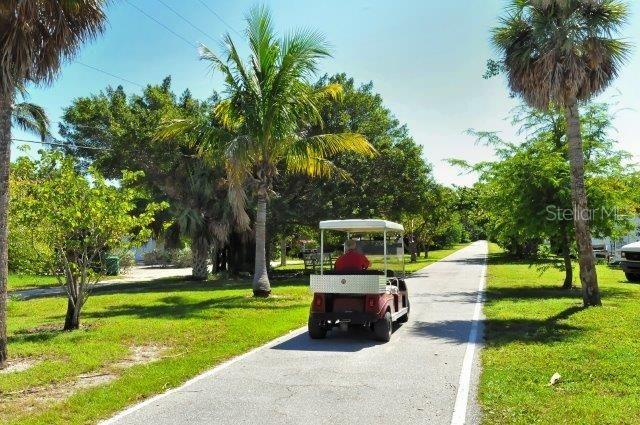 surrounding community with a lawn