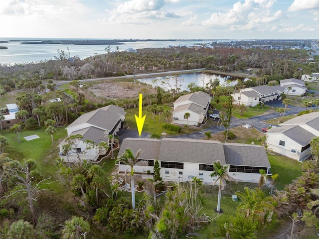 bird's eye view with a water view and a residential view