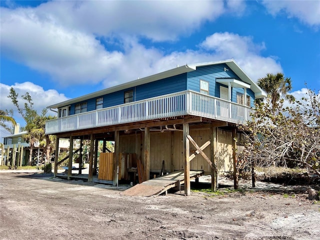 back of house with a carport