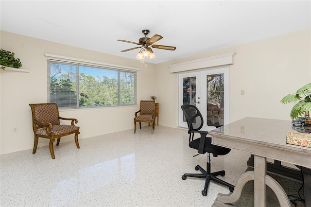 office area with ceiling fan, speckled floor, french doors, and baseboards