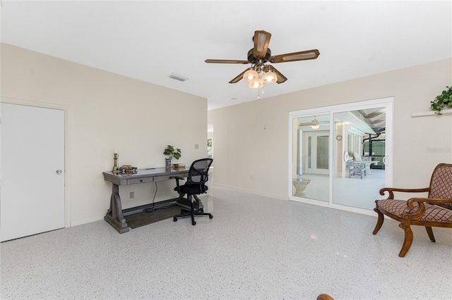 office with plenty of natural light, baseboards, visible vents, a ceiling fan, and speckled floor