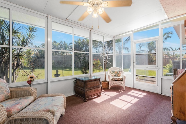 sunroom featuring ceiling fan