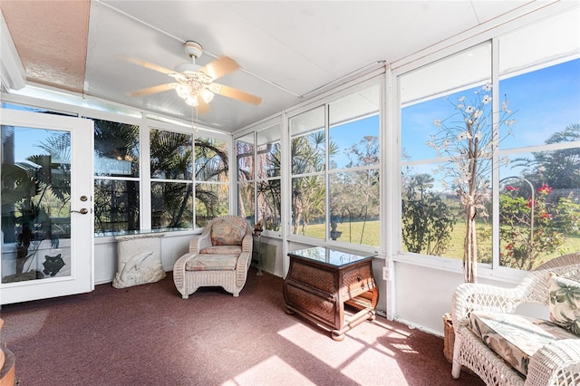 sunroom / solarium with plenty of natural light and ceiling fan