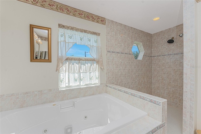 full bath featuring a whirlpool tub and a tile shower