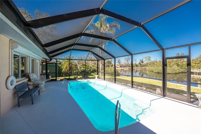 outdoor pool with a water view, a lanai, and a patio