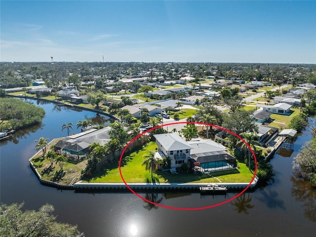 birds eye view of property featuring a water view and a residential view