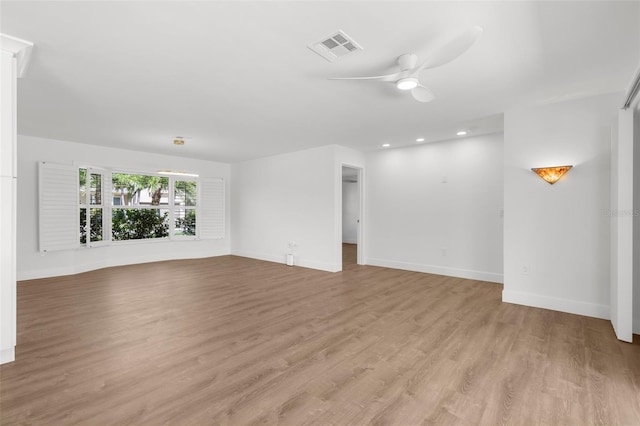 2160 Palm Tree Dr, Punta Gorda, FL 33950 - empty room with ceiling fan, light wood-style floors, and recessed lighting