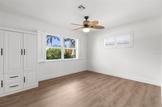 2160 Palm Tree Dr, Punta Gorda, FL 33950 - unfurnished bedroom featuring light wood-style flooring and ceiling fan