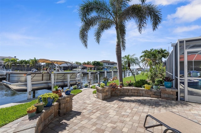 2160 Palm Tree Dr, Punta Gorda, FL 33950 - view of patio with boat lift, a boat dock, a water view, and a lanai