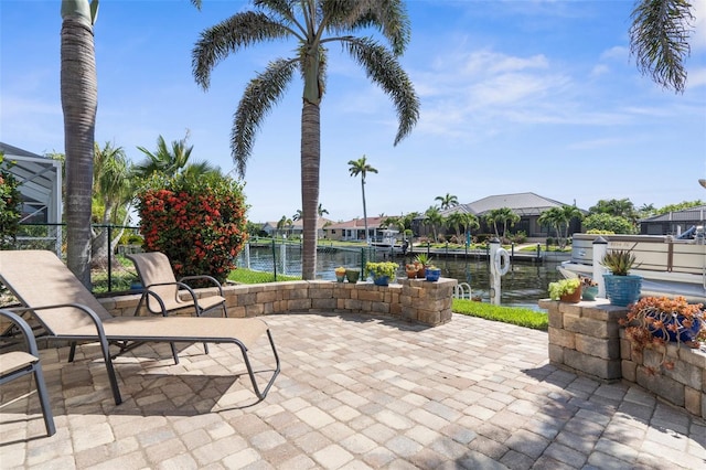 2160 Palm Tree Dr, Punta Gorda, FL 33950 - view of patio with a water view and a boat dock