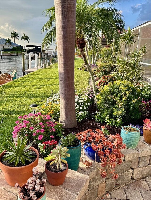 2160 Palm Tree Dr, Punta Gorda, FL 33950 - view of grassy yard with a boat dock and boat lift