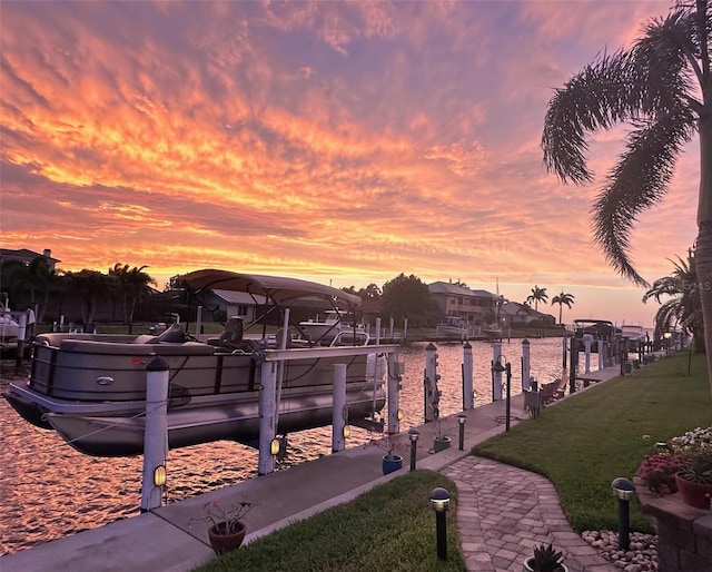 2160 Palm Tree Dr, Punta Gorda, FL 33950 - dock area featuring a water view, boat lift, and a lawn